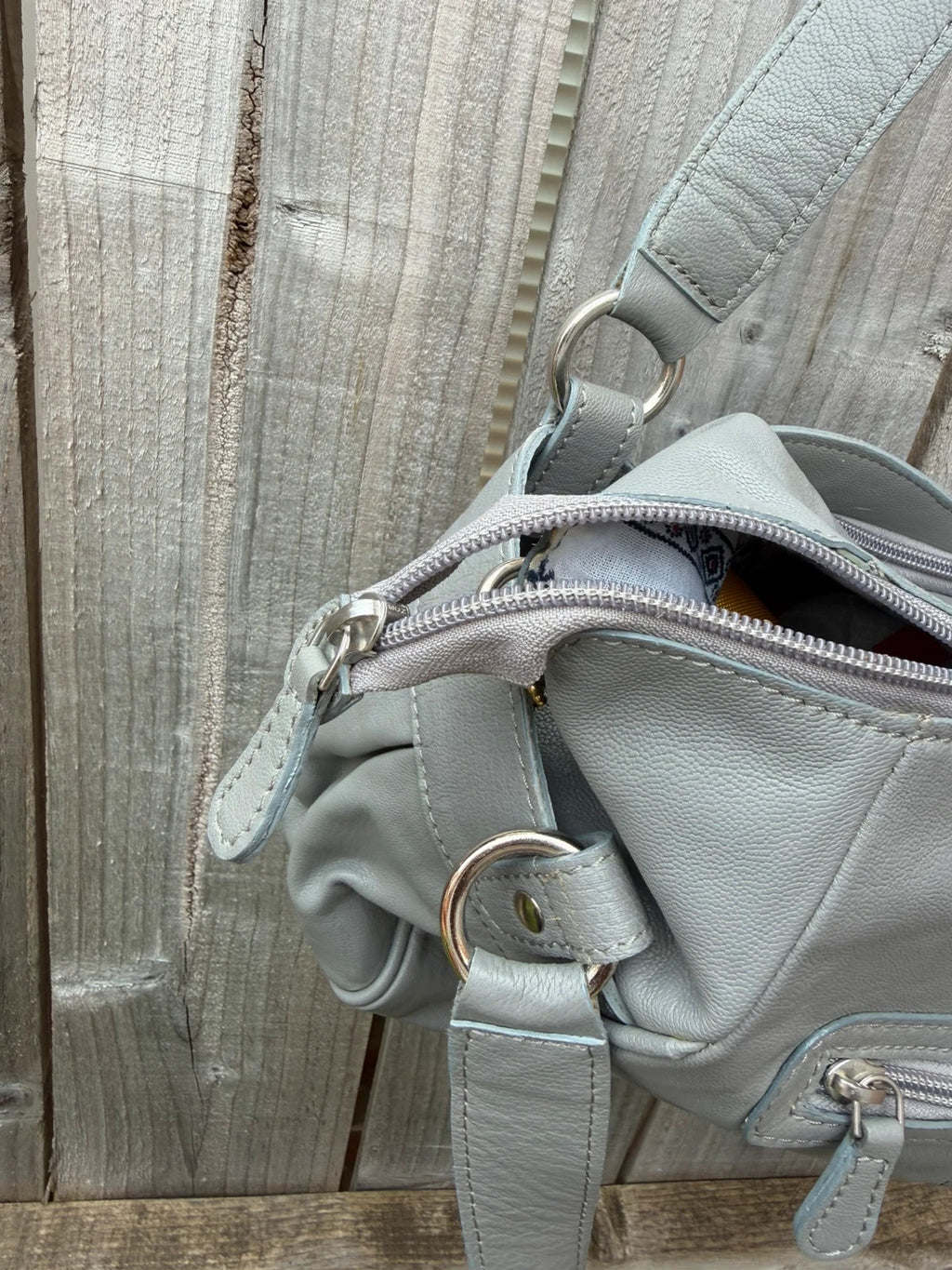 Totes grey leather shoulder bag with minimalist design and new with tags.
