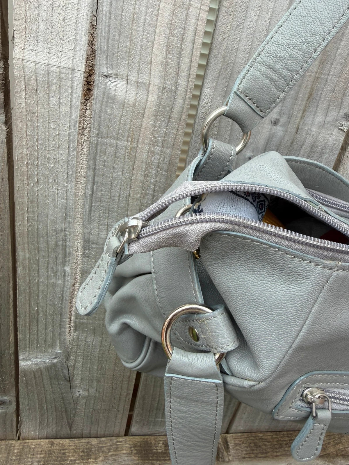 Totes grey leather shoulder bag with minimalist design and new with tags.