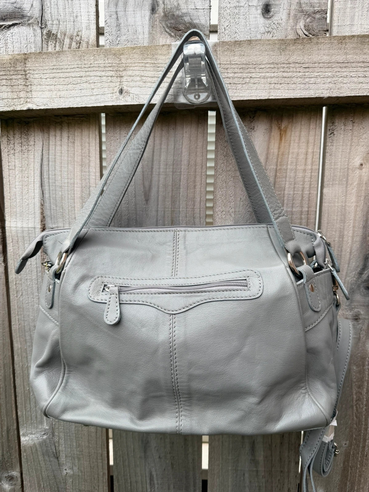 Totes grey leather shoulder bag with minimalist design and new with tags.