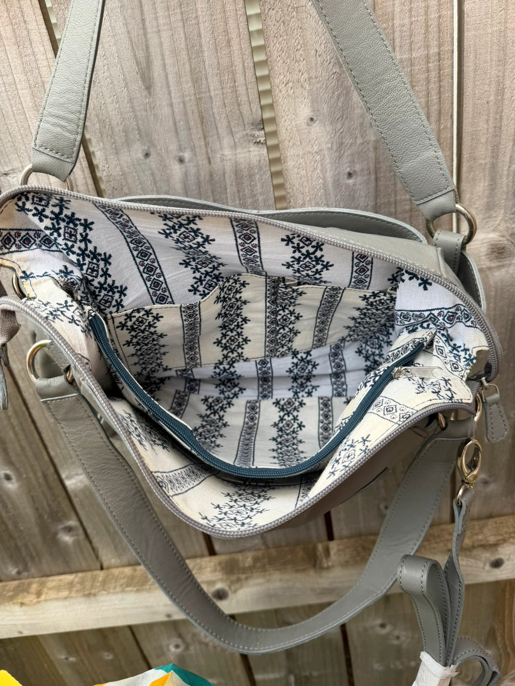Totes grey leather shoulder bag with minimalist design and new with tags.