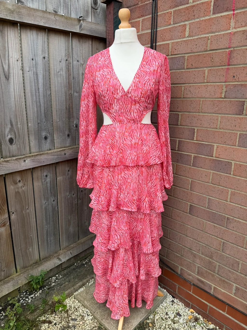 Pretty Lavish pink maxi dress with cut-out details and tiered ruffle design.
