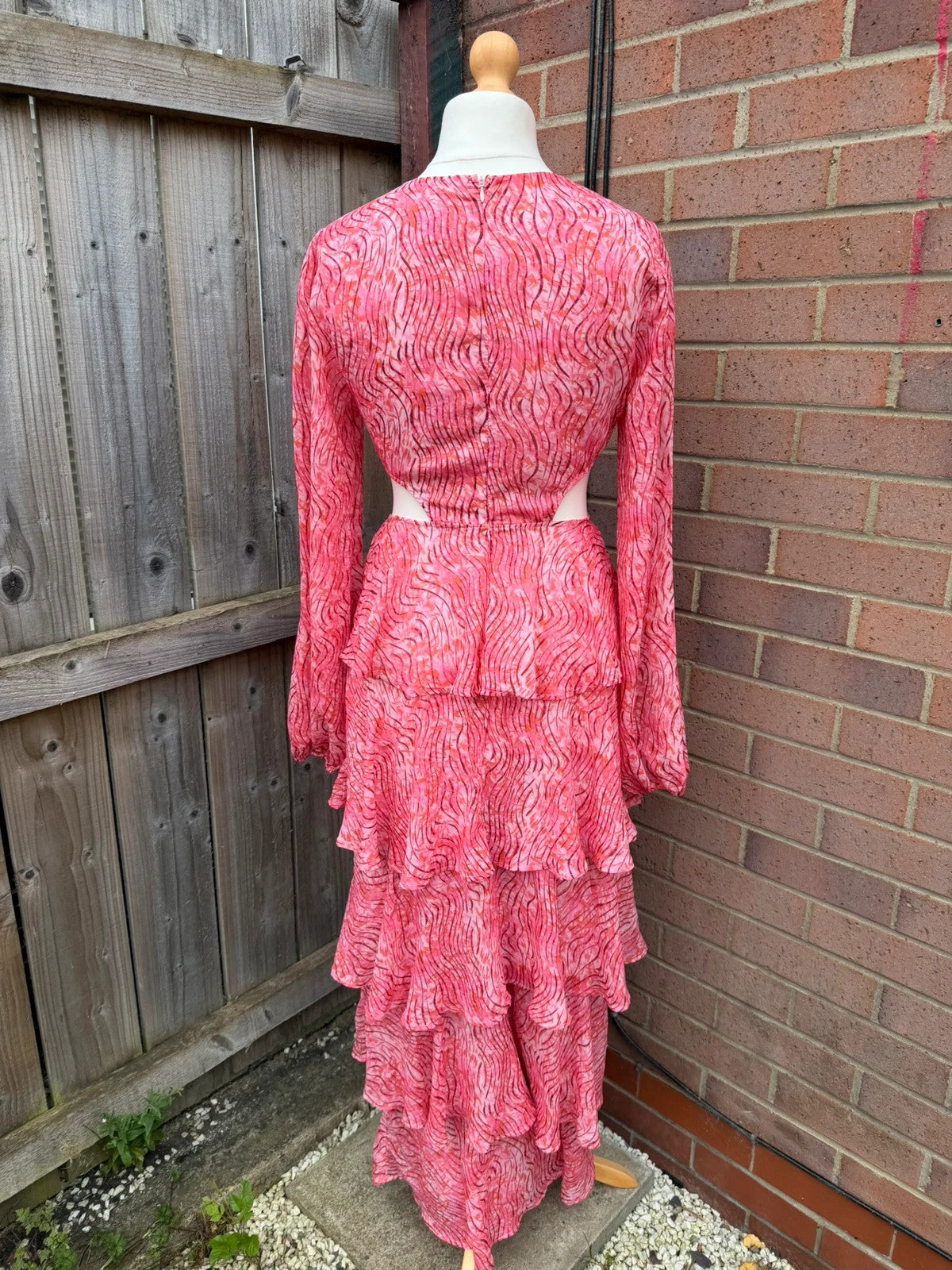 Pretty Lavish pink maxi dress with cut-out details and tiered ruffle design.