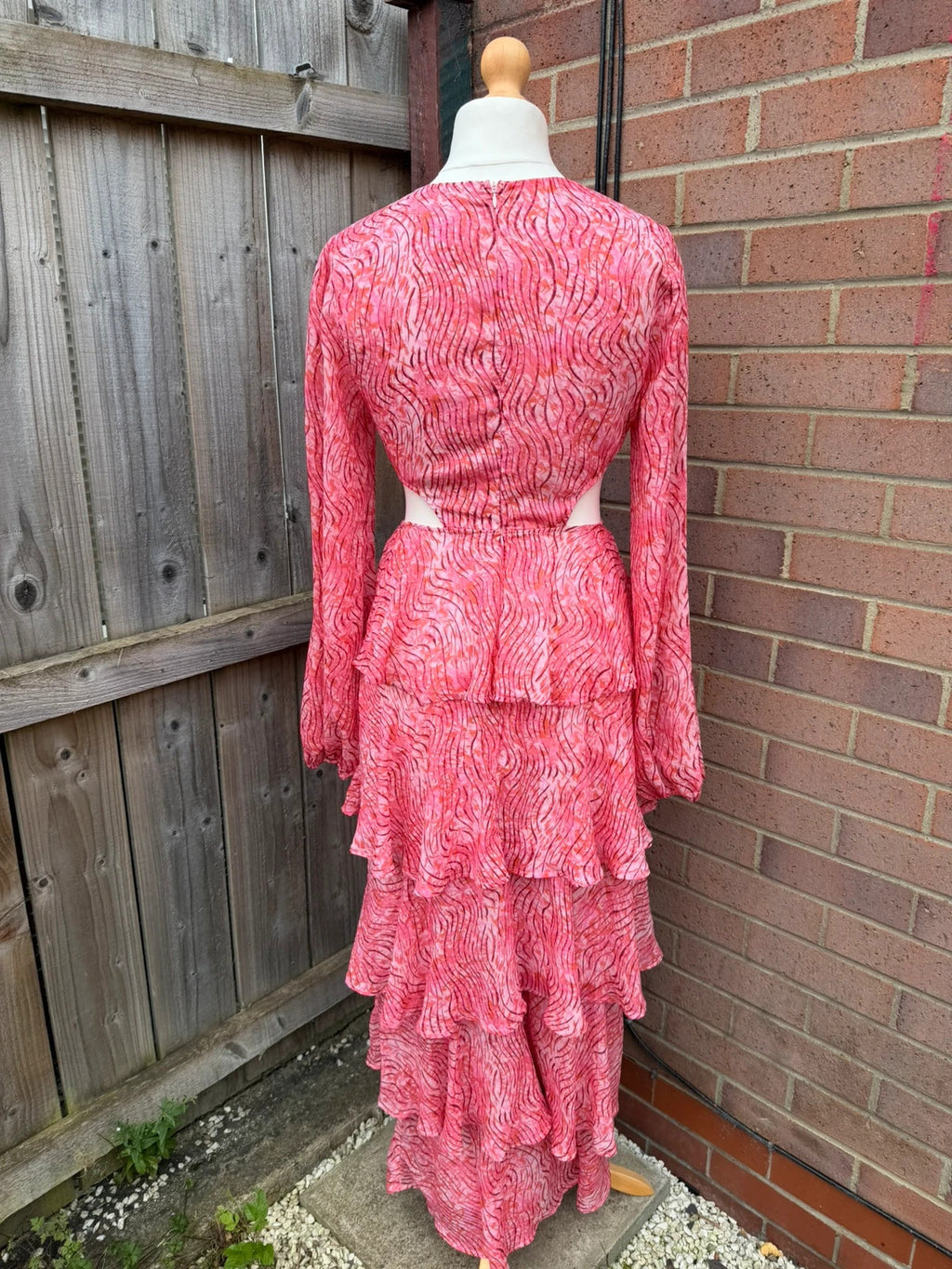 Pretty Lavish pink maxi dress with cut-out details and tiered ruffle design.