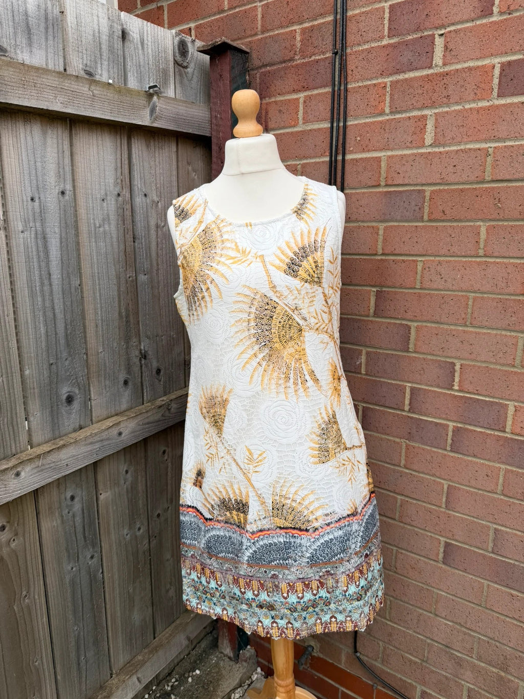 Izabel London multi floral lace sleeveless midi dress with intricate lace detailing.