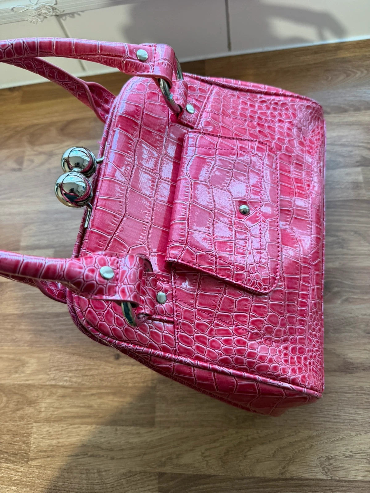 Vintage pink faux crocodile handbag with Y2K style and textured finish.