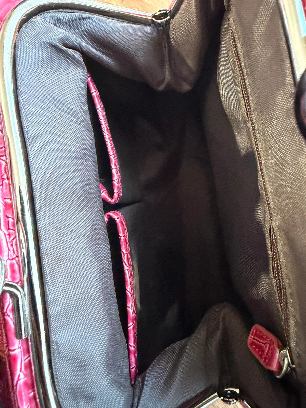 Vintage pink faux crocodile handbag with Y2K style and textured finish.