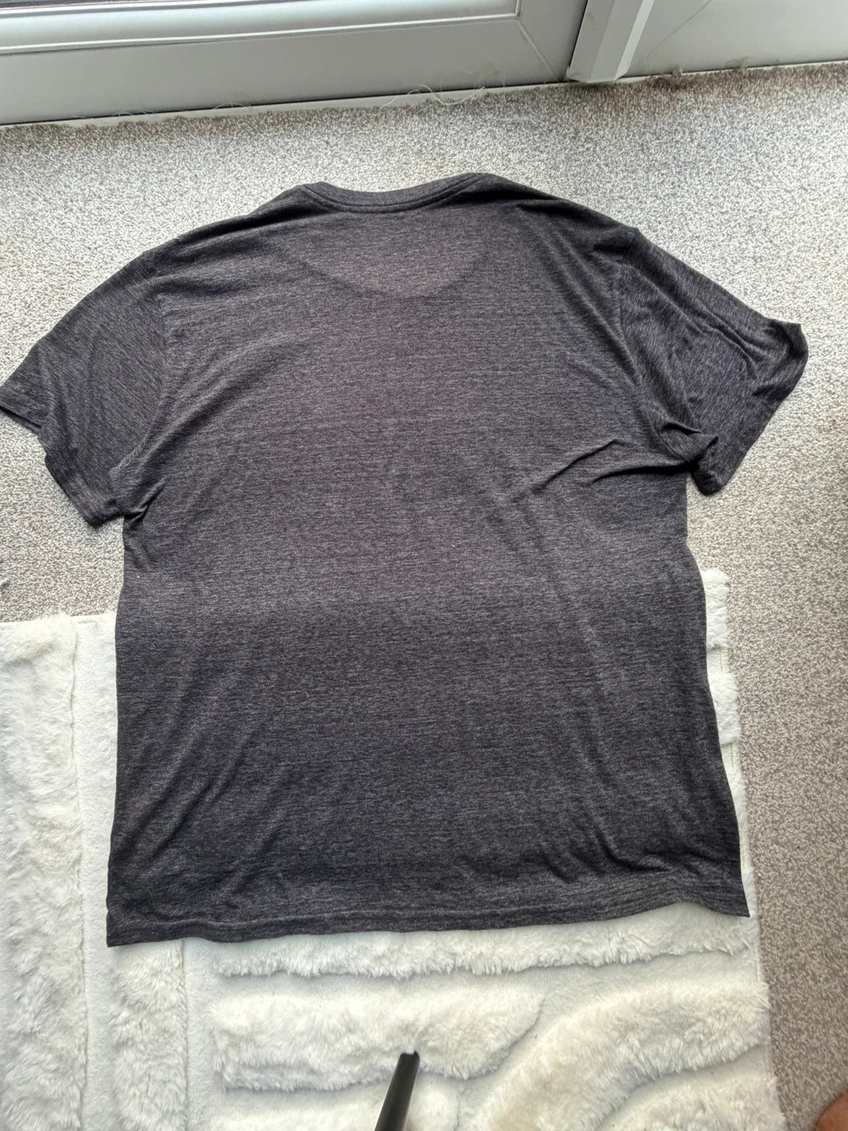 Blue 84 grey graphic tee featuring Miami Hurricanes logo and vintage design.