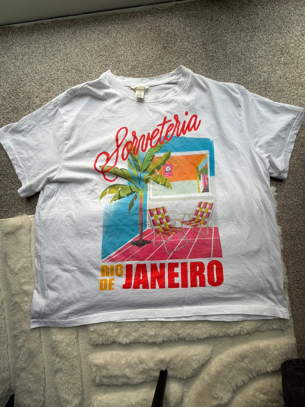 H&M multi graphic tee featuring vintage Brazil tourist print on white fabric.
