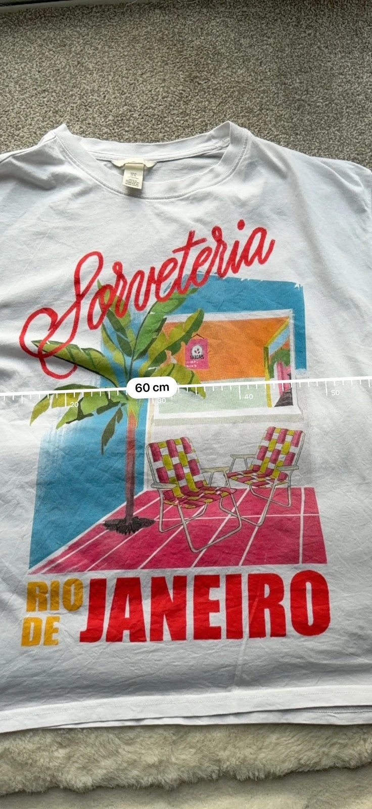 H&M multi graphic tee featuring vintage Brazil tourist print on white fabric.