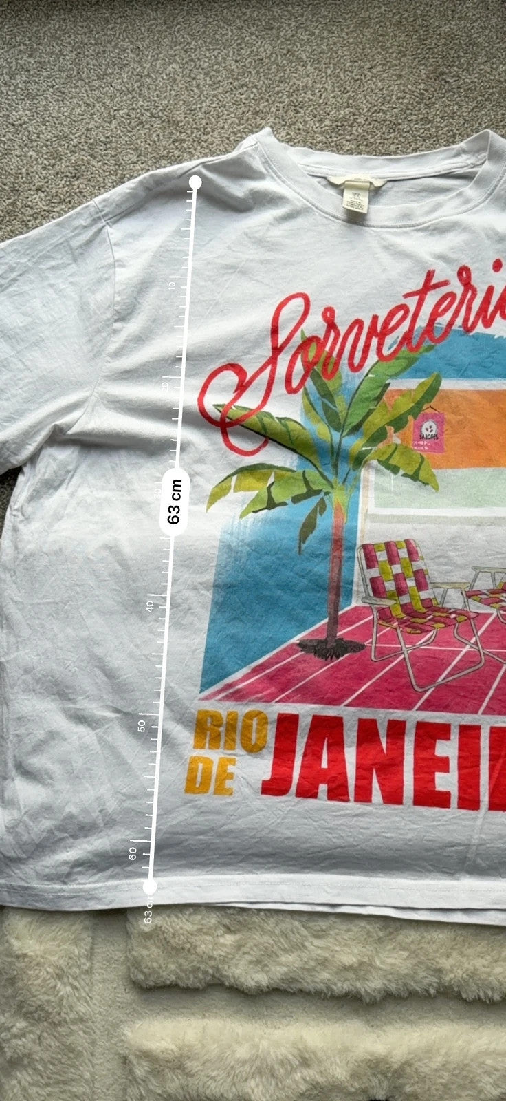 H&M multi graphic tee featuring vintage Brazil tourist print on white fabric.
