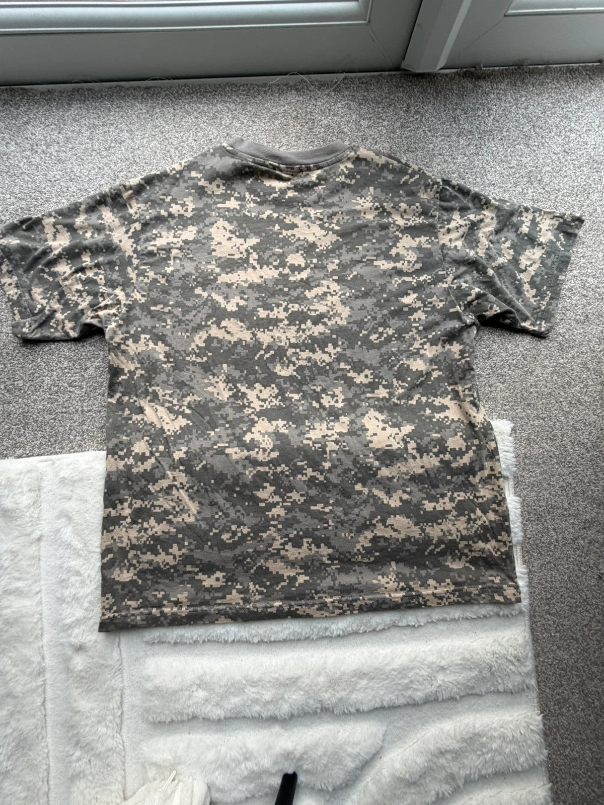Army khaki graphic tee with camo pattern and streetwear style.
