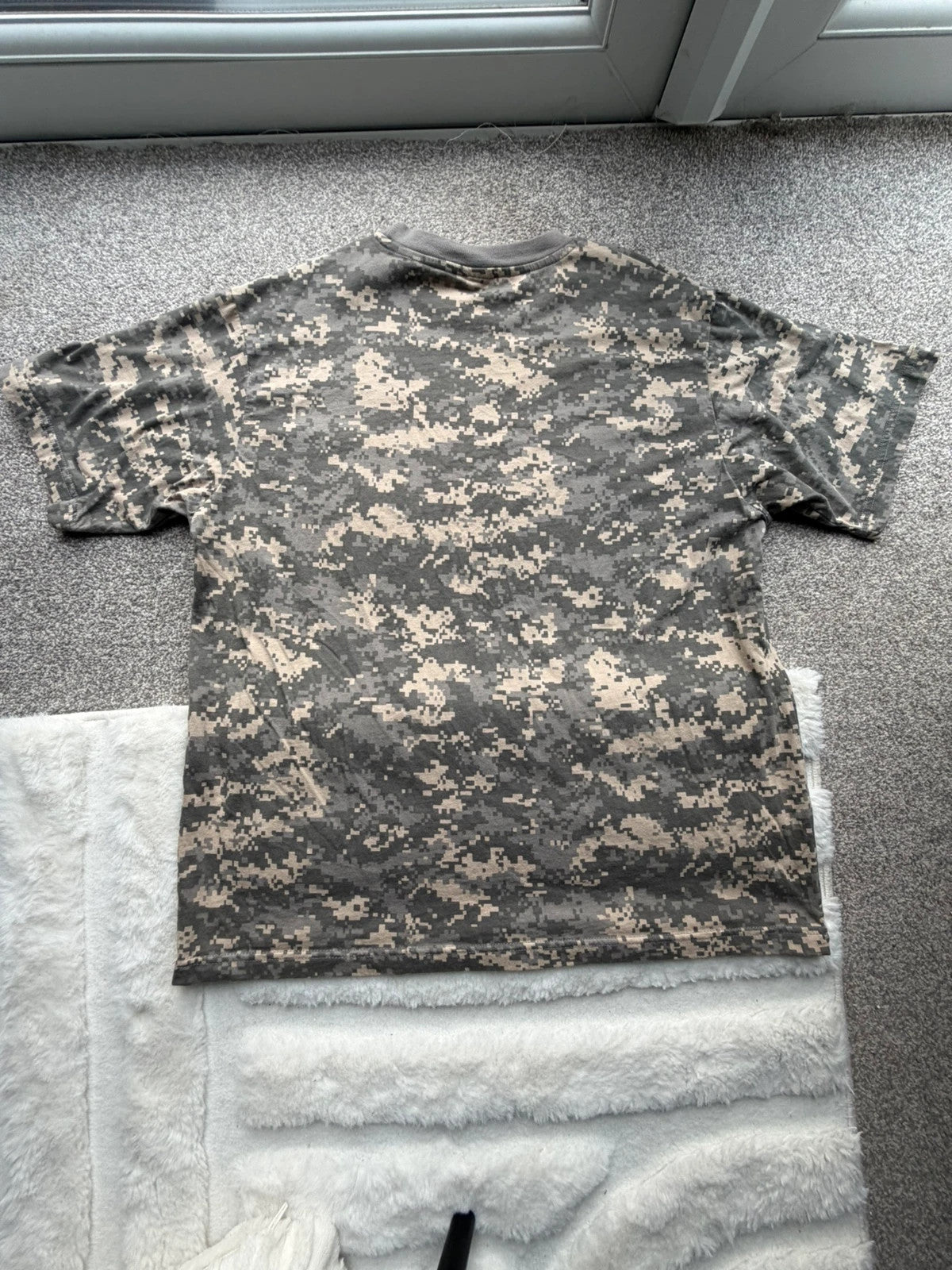 Army khaki graphic tee with camo pattern and streetwear style.