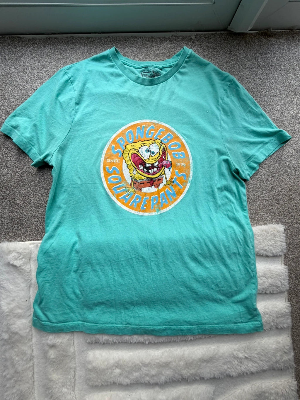 SpongeBob SquarePants blue and green graphic tee featuring cartoon print and vintage Y2K style.