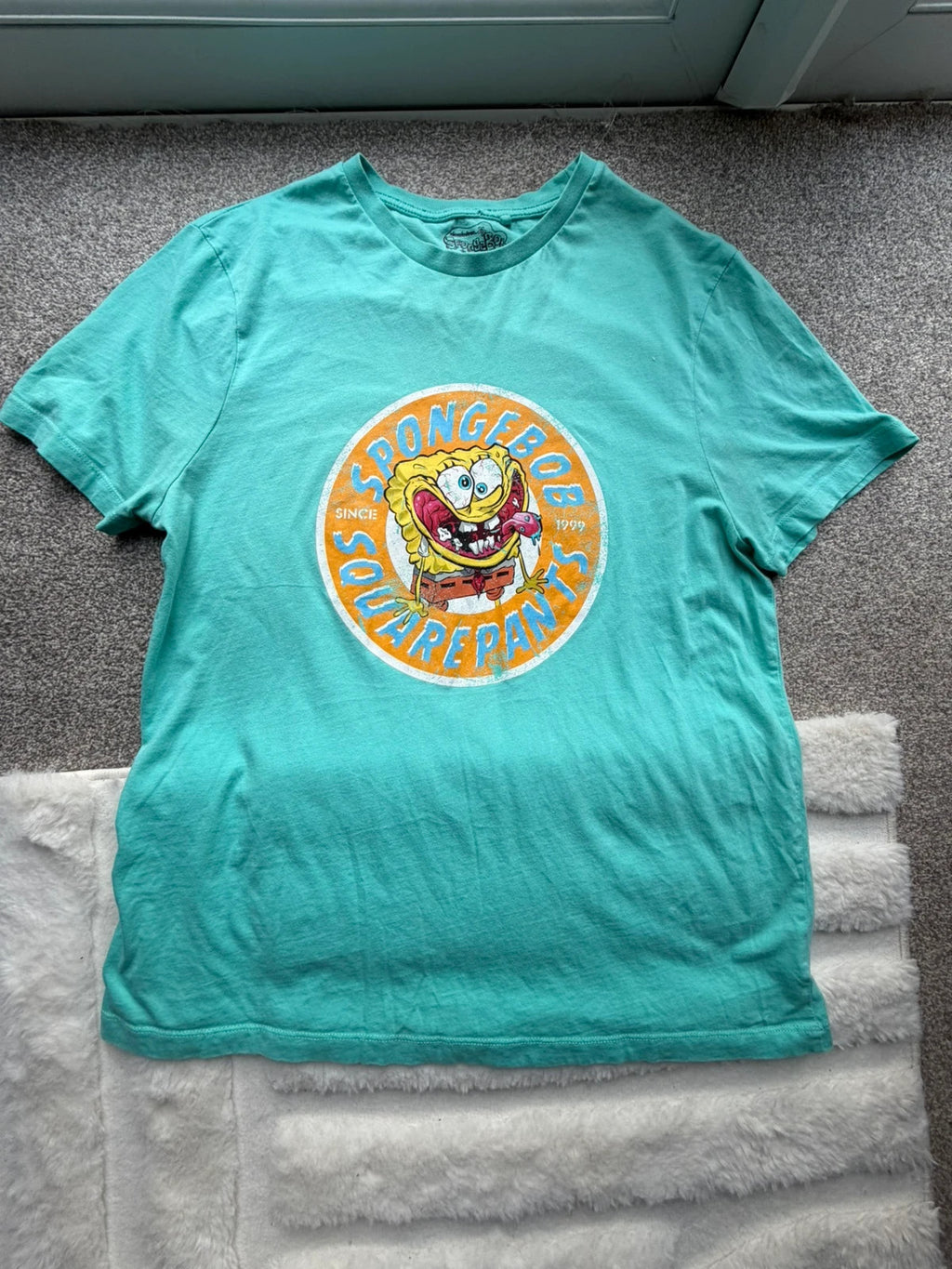 SpongeBob SquarePants blue and green graphic tee featuring cartoon print and vintage Y2K style.