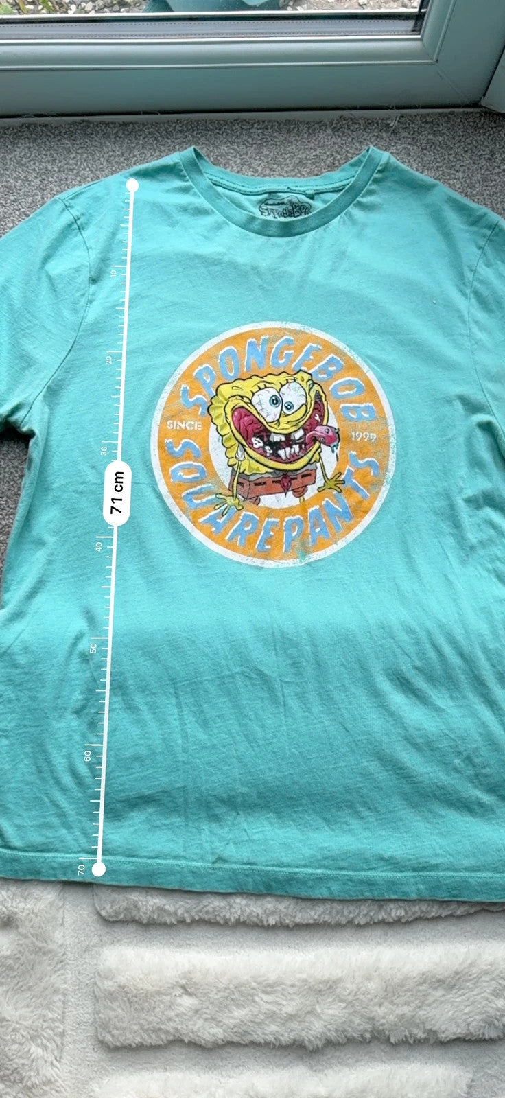 SpongeBob SquarePants blue and green graphic tee featuring cartoon print and vintage Y2K style.