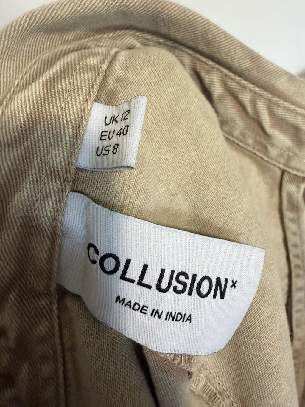 COLLUSION khaki denim jumpsuit with relaxed fit and minimalist design.
