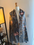 Accessorize multi floral oversized winter scarf with soft fabric and vibrant pink accents.