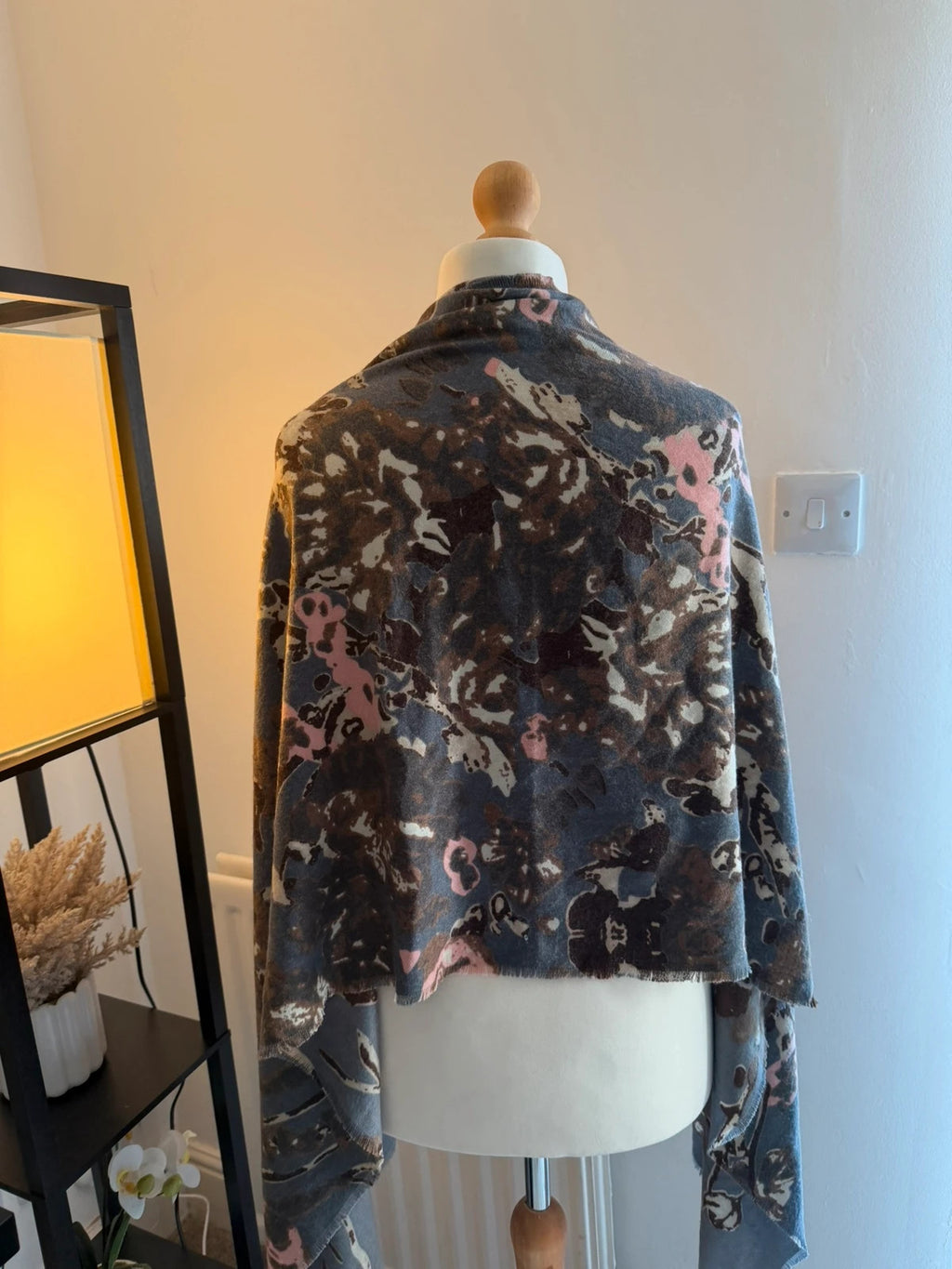 Accessorize multi floral oversized winter scarf with soft fabric and vibrant pink accents.