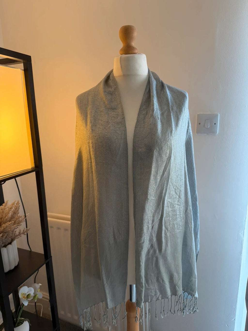 Silver metallic shimmer scarf with a sleek grey and silver finish.
