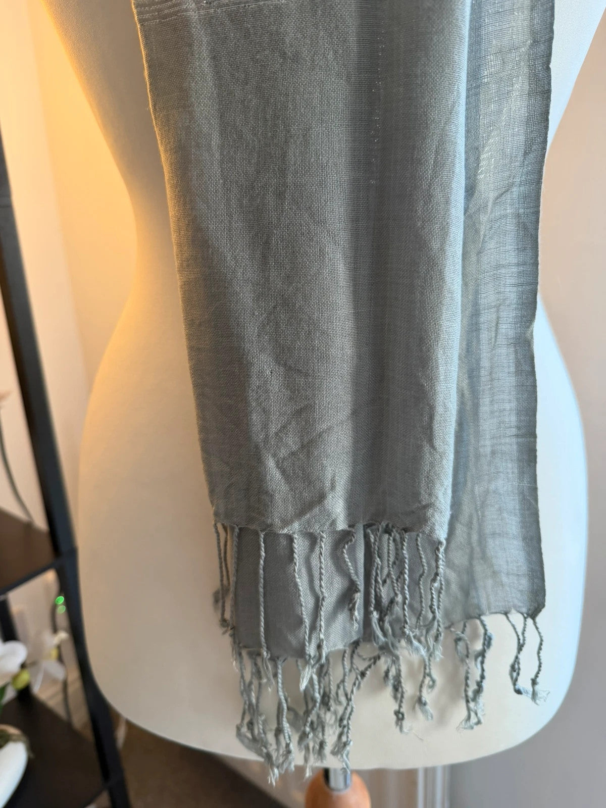 Silver metallic shimmer scarf with a sleek grey and silver finish.