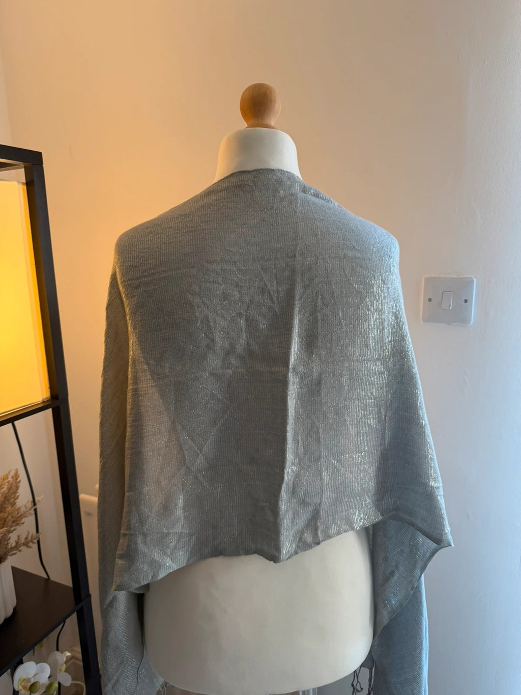 Silver metallic shimmer scarf with a sleek grey and silver finish.