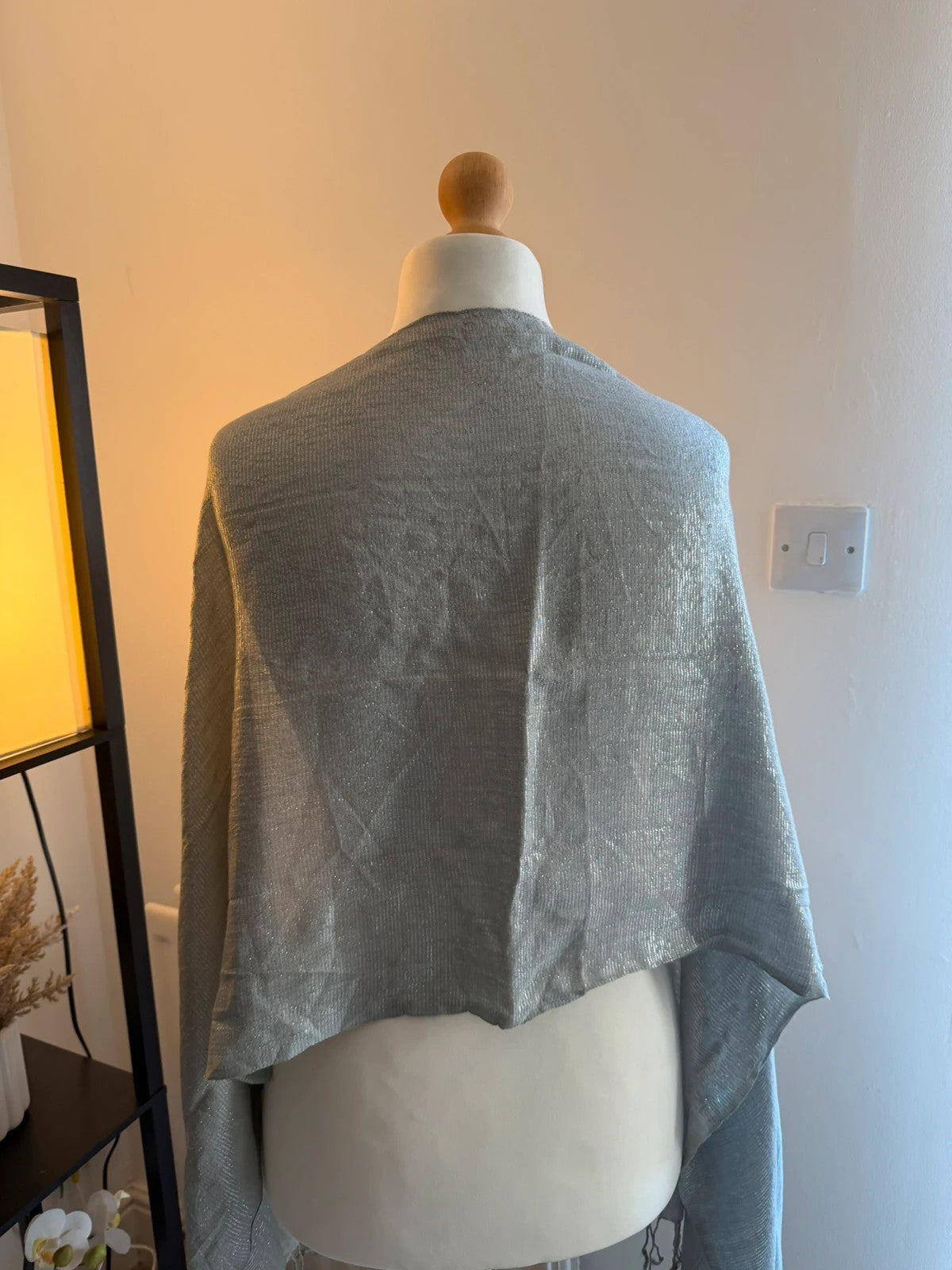 Silver metallic shimmer scarf with a sleek grey and silver finish.