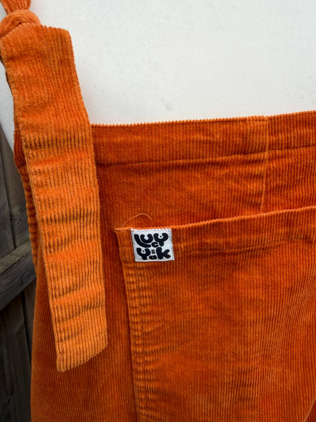 Lucy & Yak orange cord dungarees relaxed fit boho pattern logo patched material