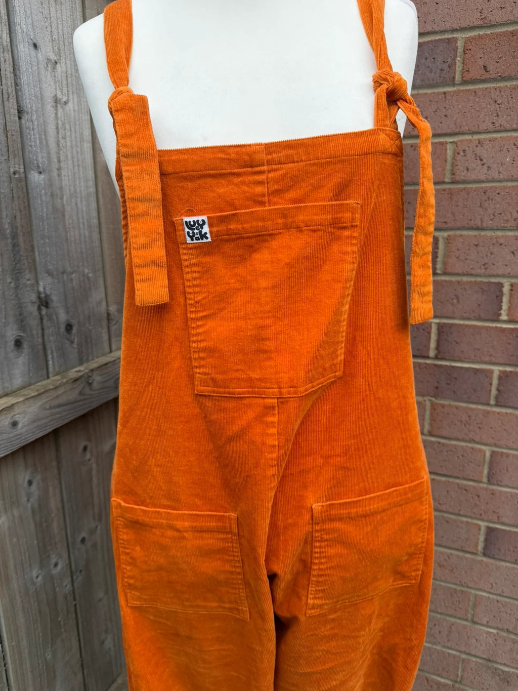 Lucy & Yak orange cord dungarees relaxed fit boho pattern logo patched material