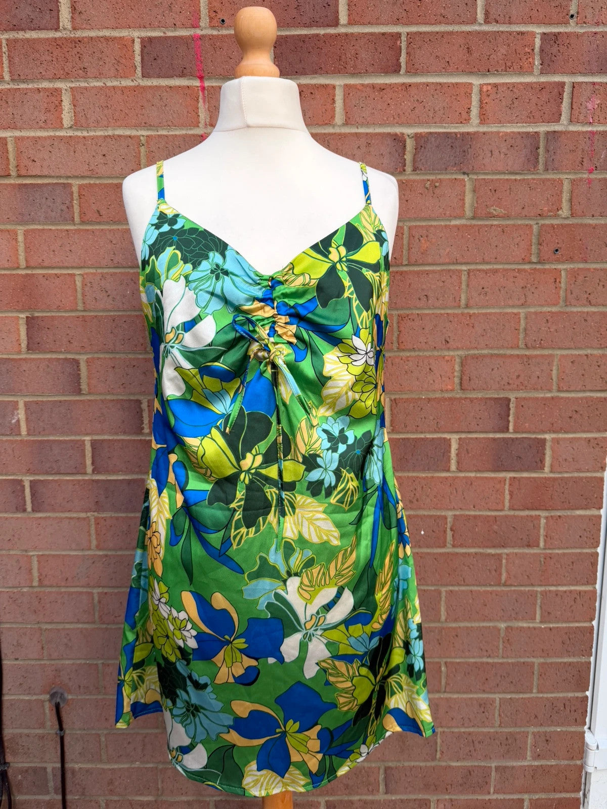 Boohoo multi tropical floral satin slip dress with cami straps and mini length.