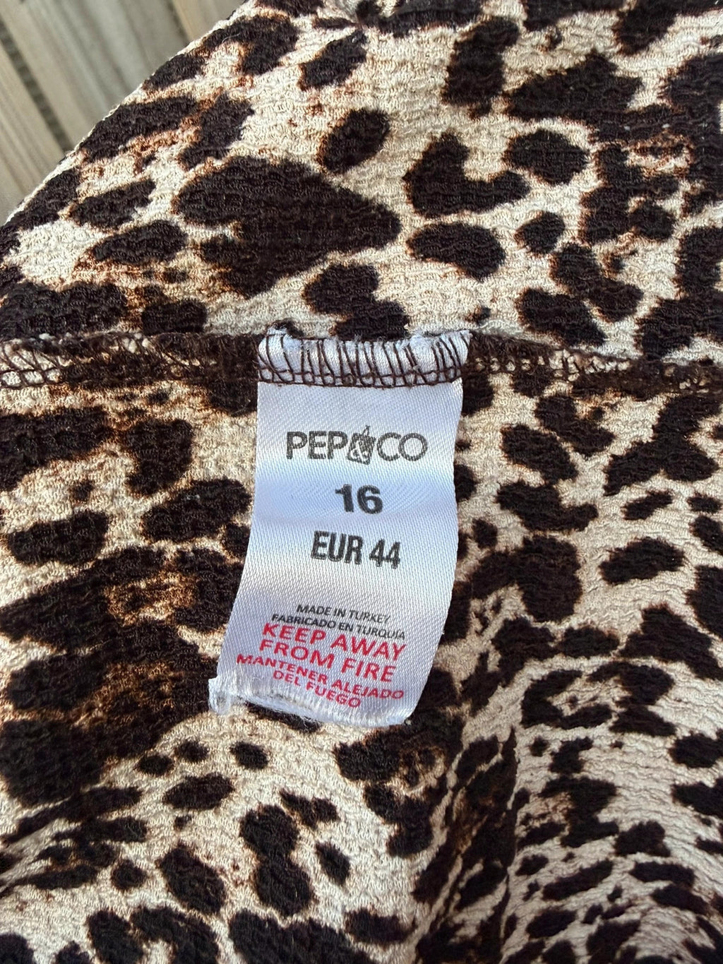 Pep&Co beige smock mini dress with leopard print pattern and 3/4 sleeves.