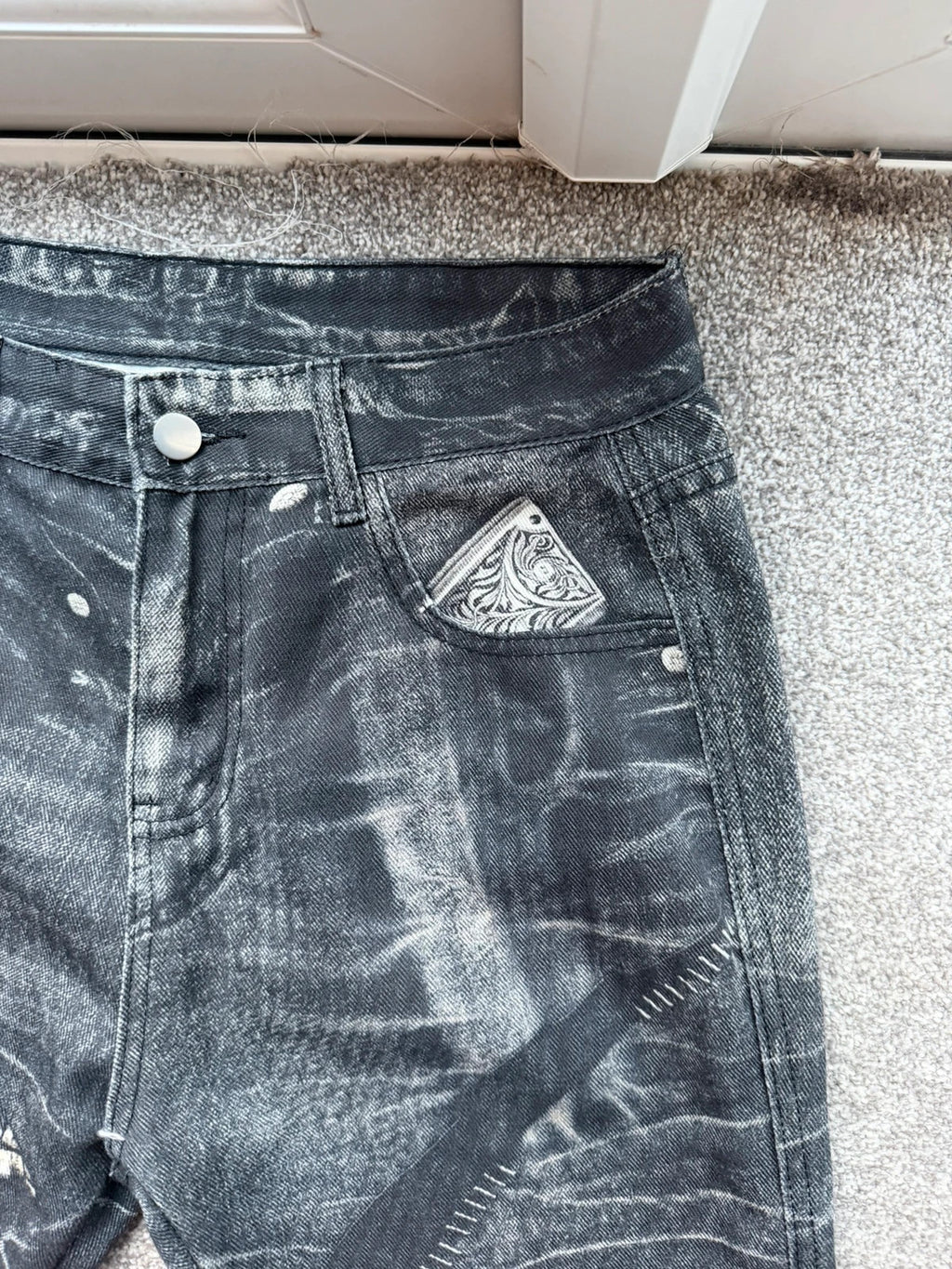 Vintage Denim black straight jeans with grey graphic print and wide leg style.