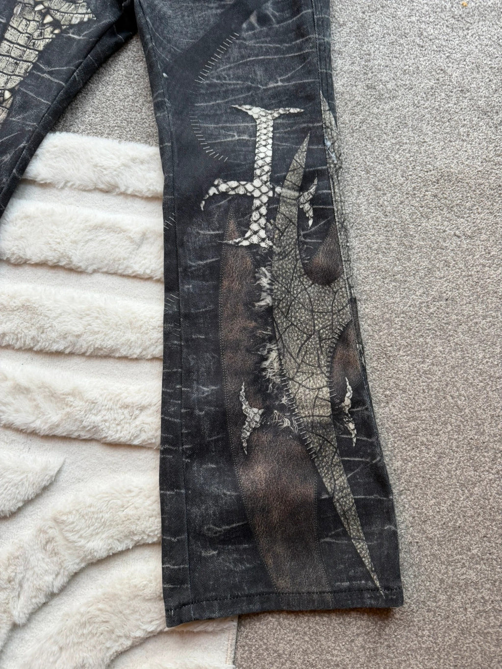 Vintage Denim black straight jeans with grey graphic print and wide leg style.