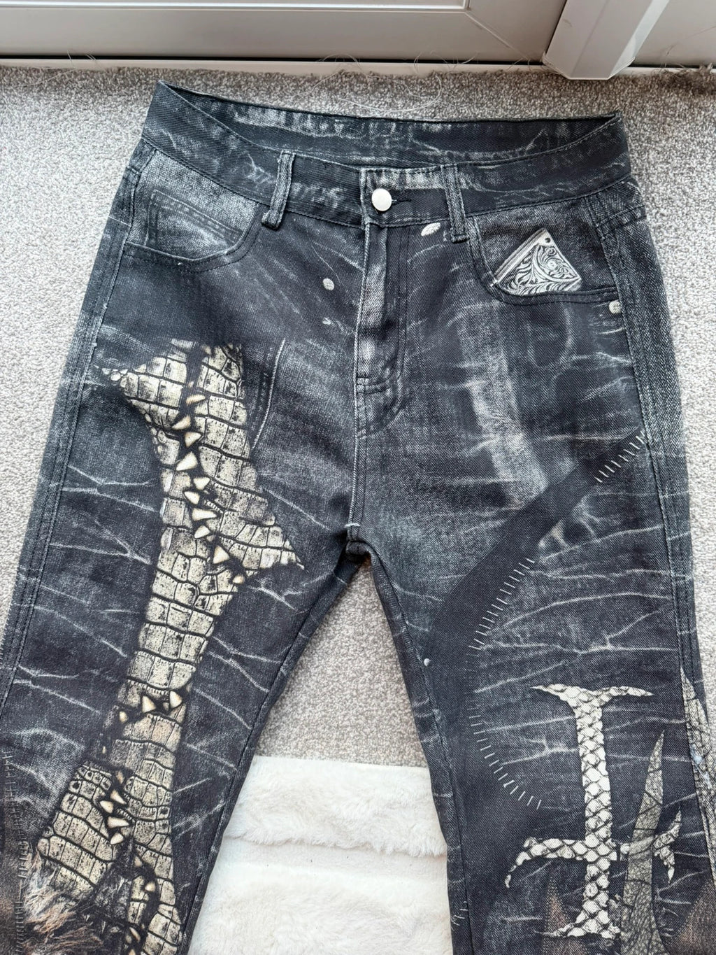 Vintage Denim black straight jeans with grey graphic print and wide leg style.