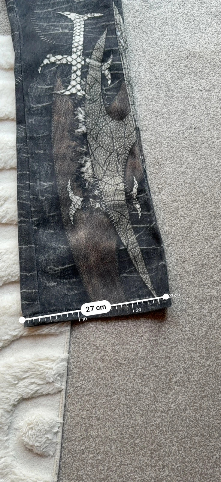 Vintage Denim black straight jeans with grey graphic print and wide leg style.