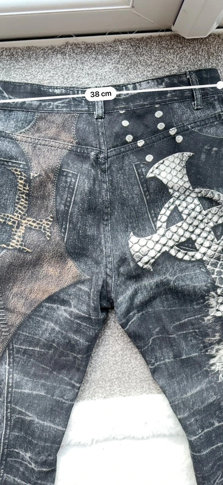 Vintage Denim black straight jeans with grey graphic print and wide leg style.