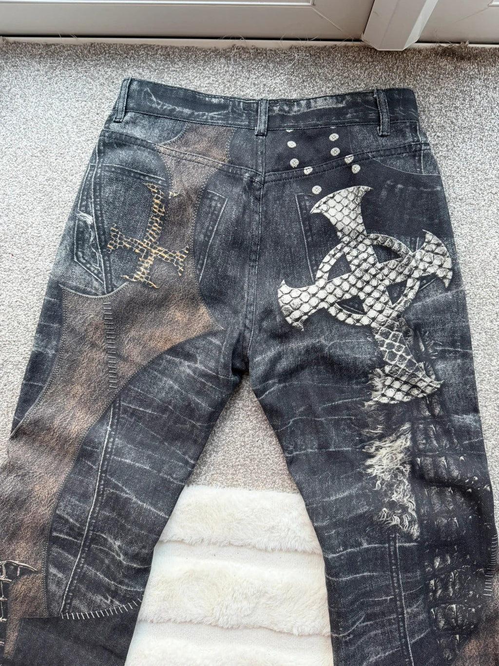 Vintage Denim black straight jeans with grey graphic print and wide leg style.