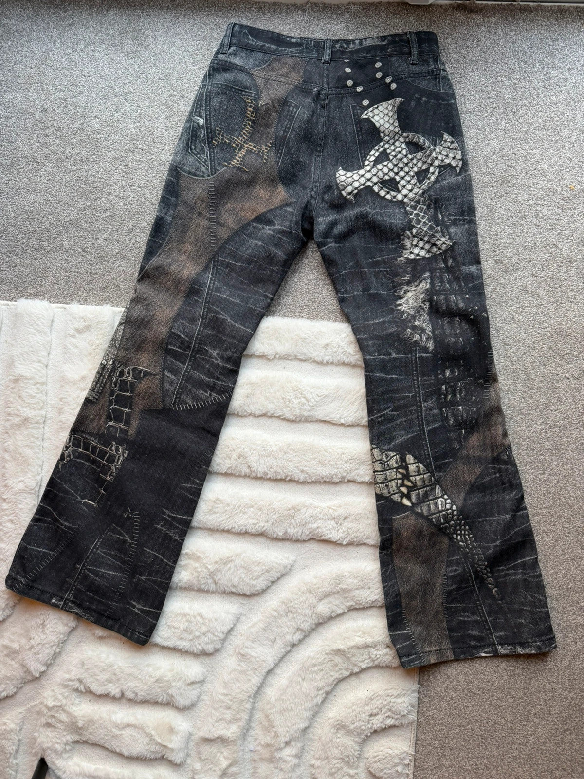 Vintage Denim black straight jeans with grey graphic print and wide leg style.