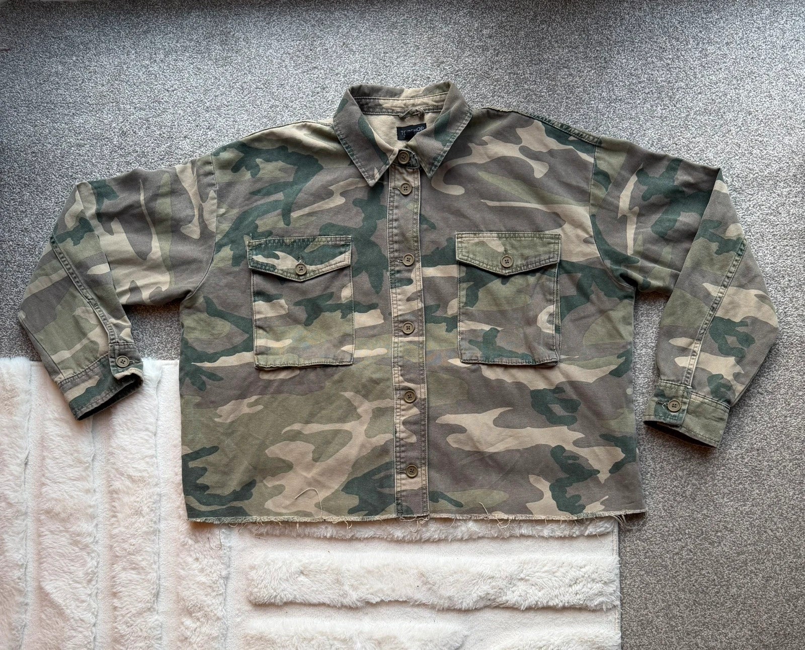 Topshop green camo shacket utility jacket with pockets and military-style design.
