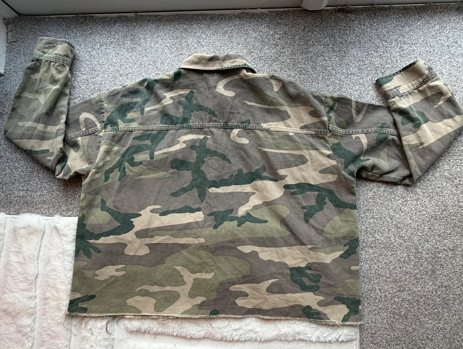Topshop green camo shacket utility jacket with pockets and military-style design.