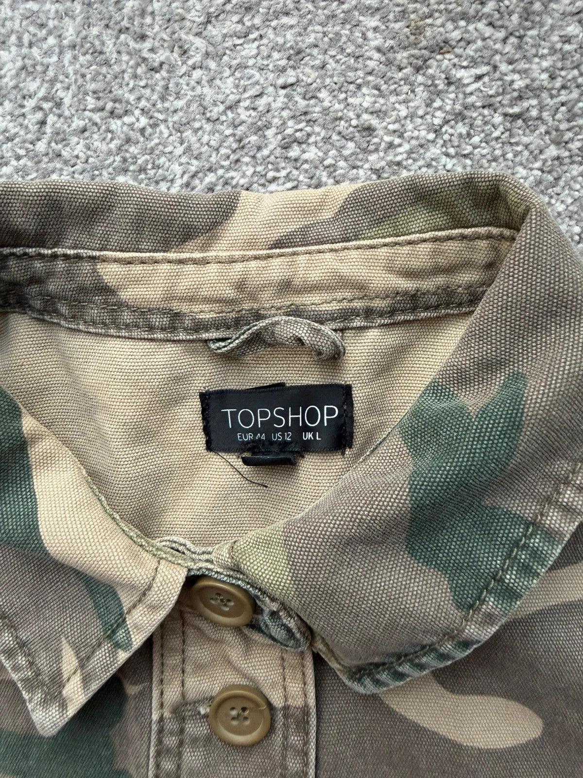 Topshop green camo shacket utility jacket with pockets and military-style design.