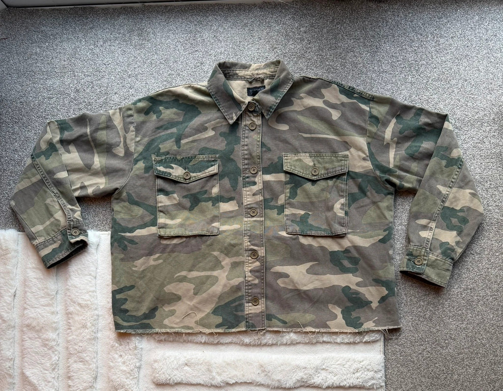 Topshop green camo shacket utility jacket with pockets and military-style design.