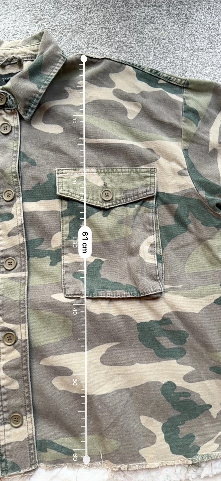 Topshop green camo shacket utility jacket with pockets and military-style design.