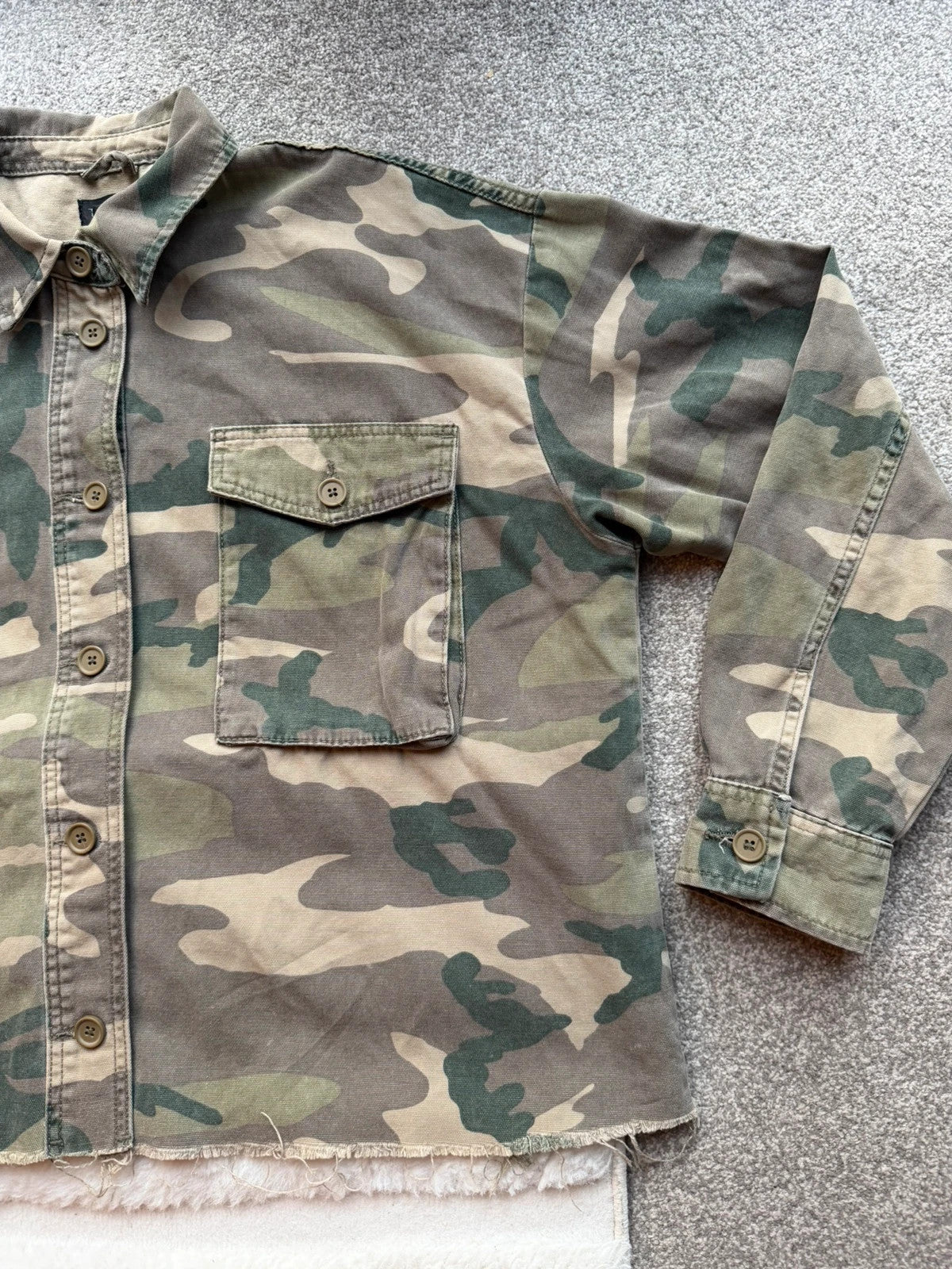 Topshop green camo shacket utility jacket with pockets and military-style design.