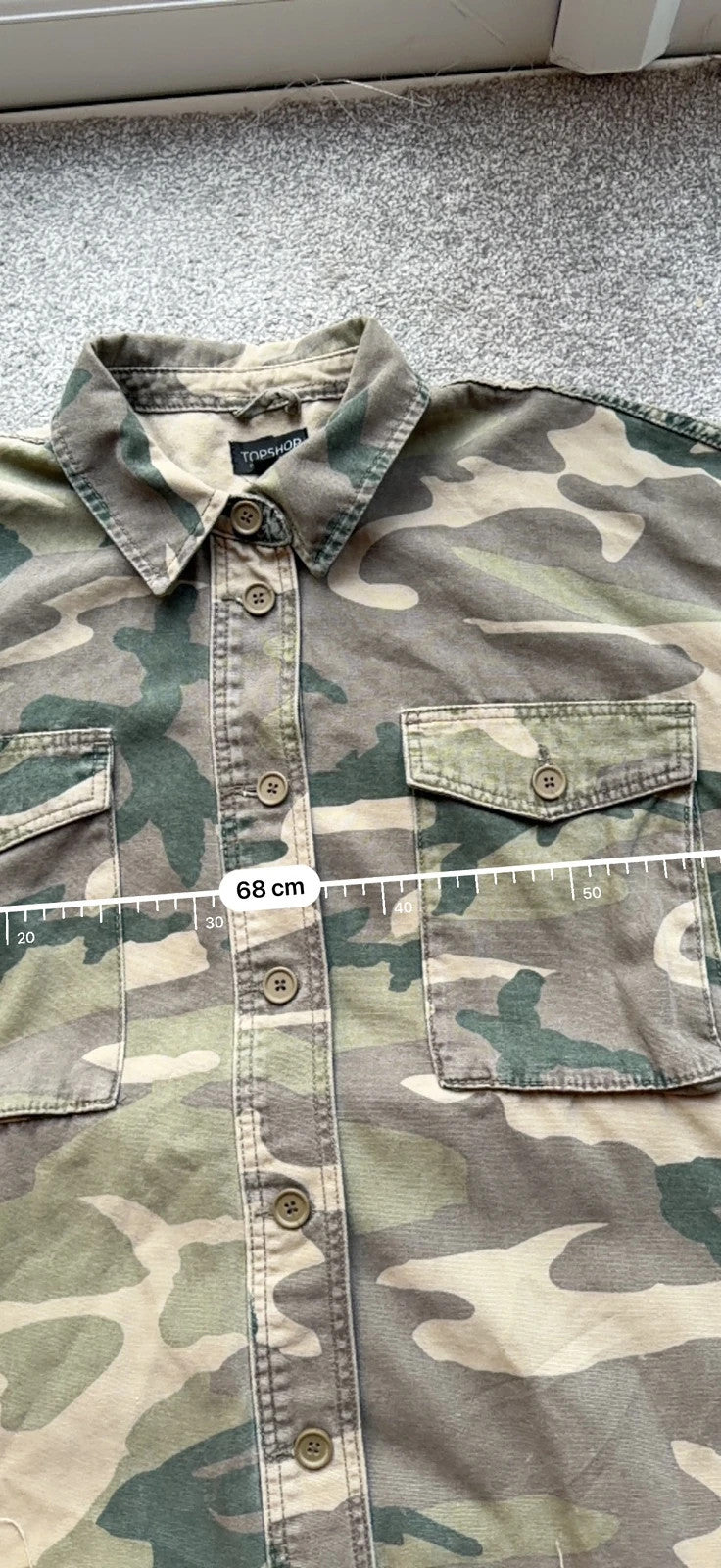 Topshop green camo shacket utility jacket with pockets and military-style design.