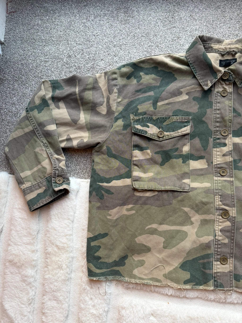 Topshop green camo shacket utility jacket with pockets and military-style design.