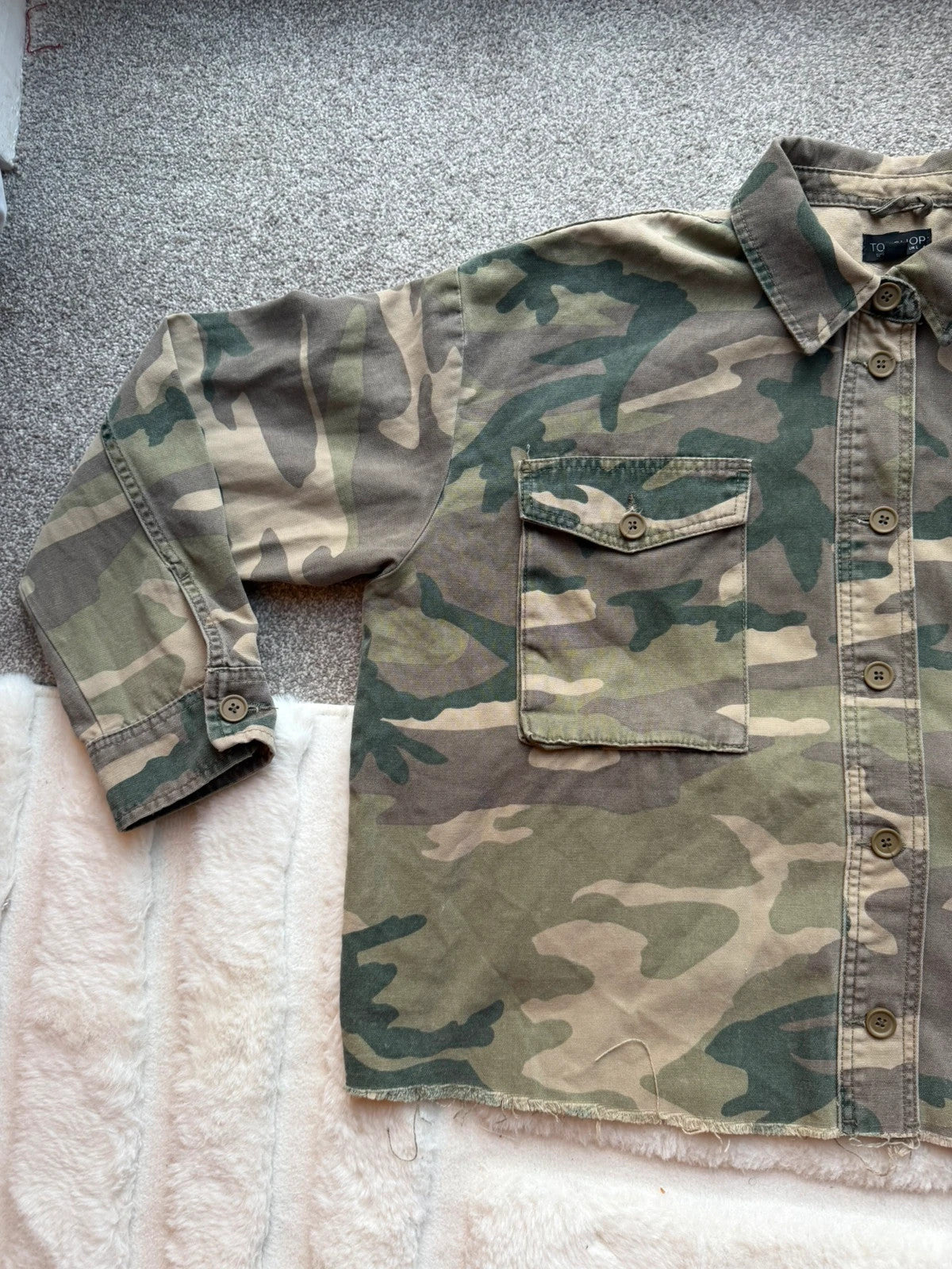Topshop green camo shacket utility jacket with pockets and military-style design.