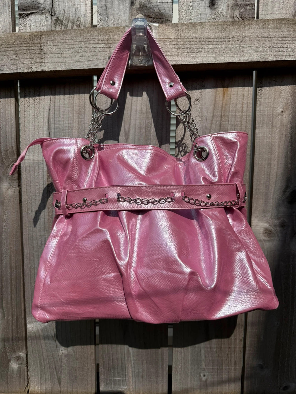 Vintage Dressing pink slouch shoulder bag with chain detail and large tote design.
