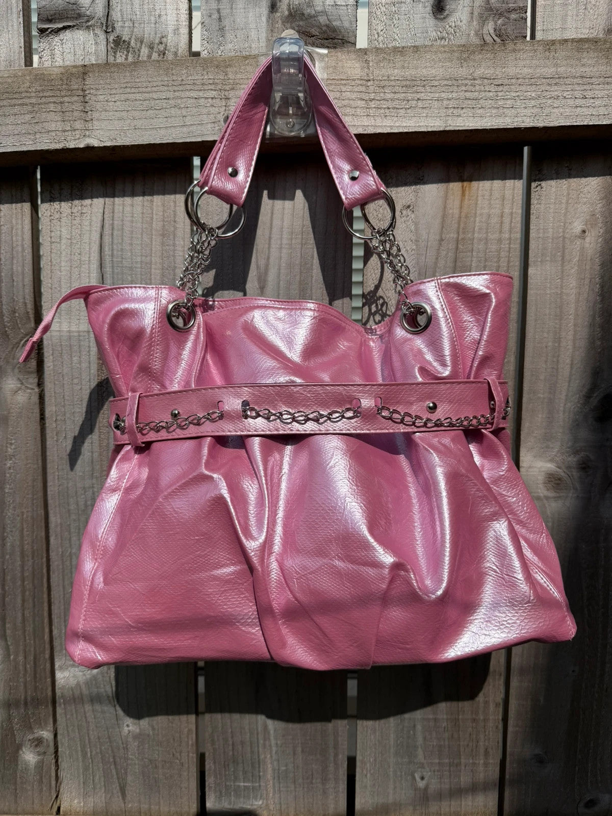 Vintage Dressing pink slouch shoulder bag with chain detail and large tote design.