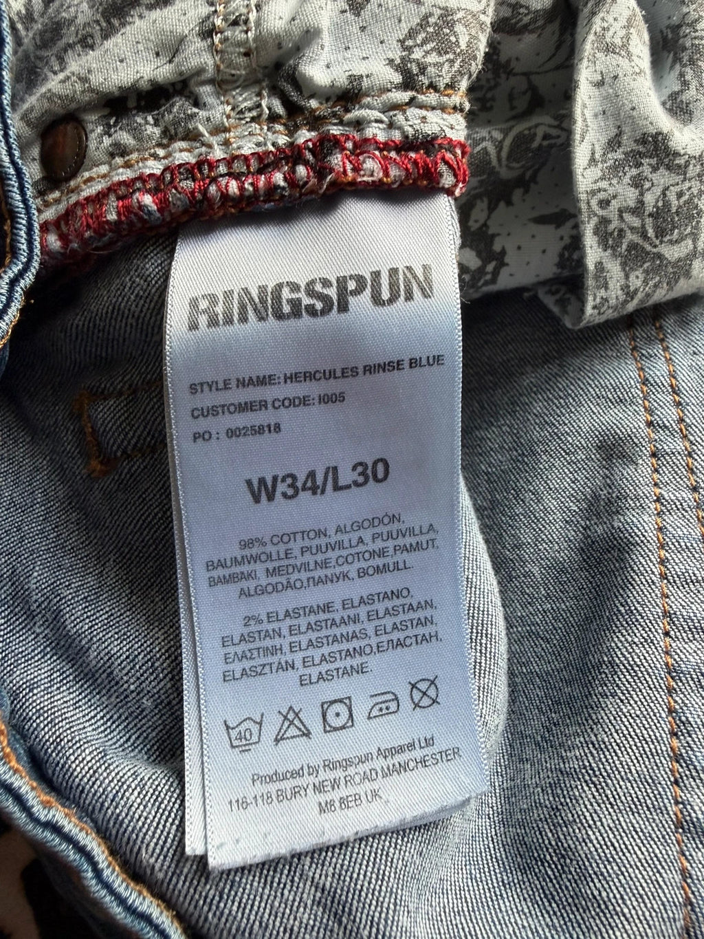 Ringspun blue denim shorts with distressed details and rolled hem.