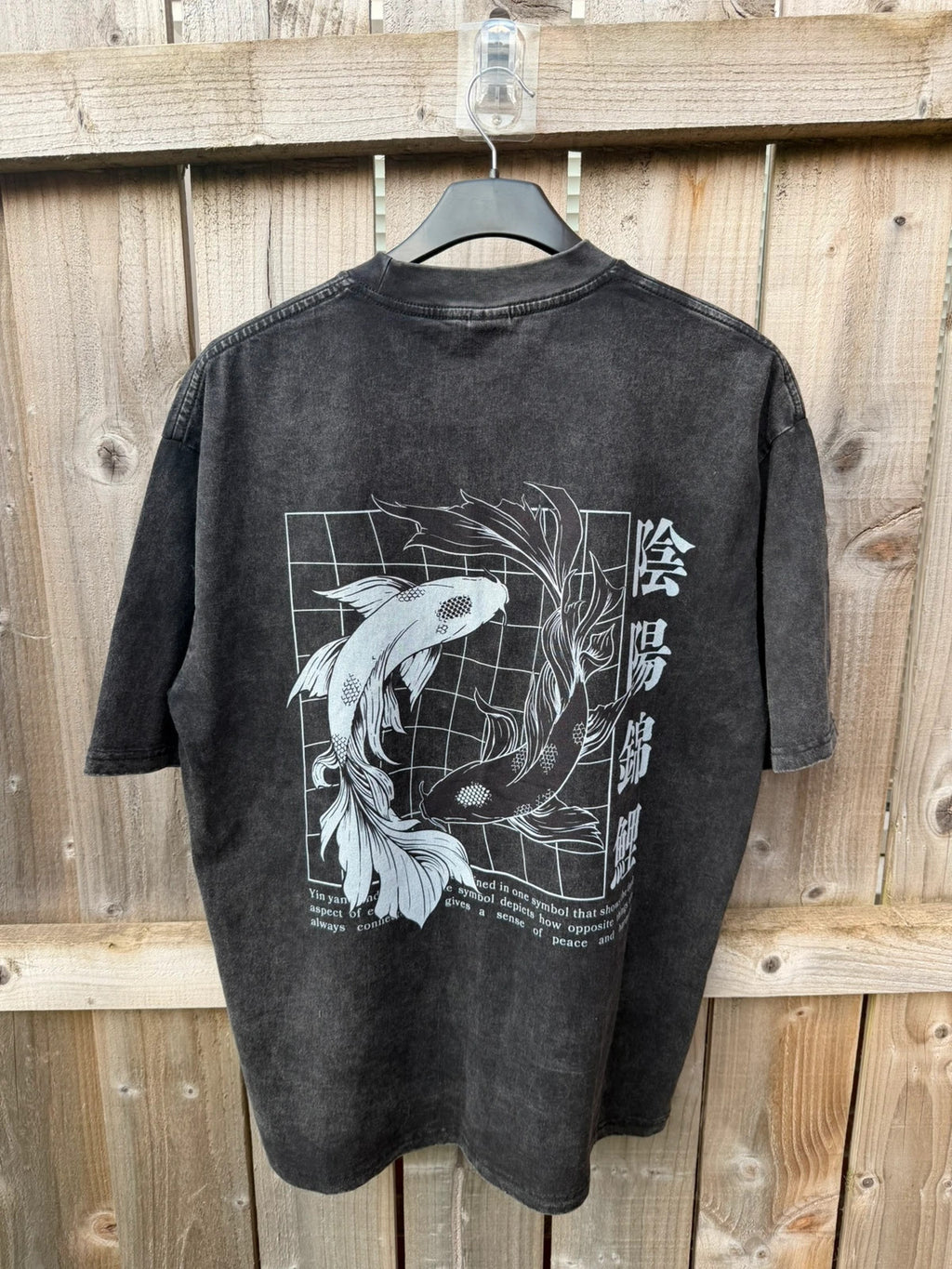 Vintage Dressing black and grey acid wash graphic tee featuring koi fish design.